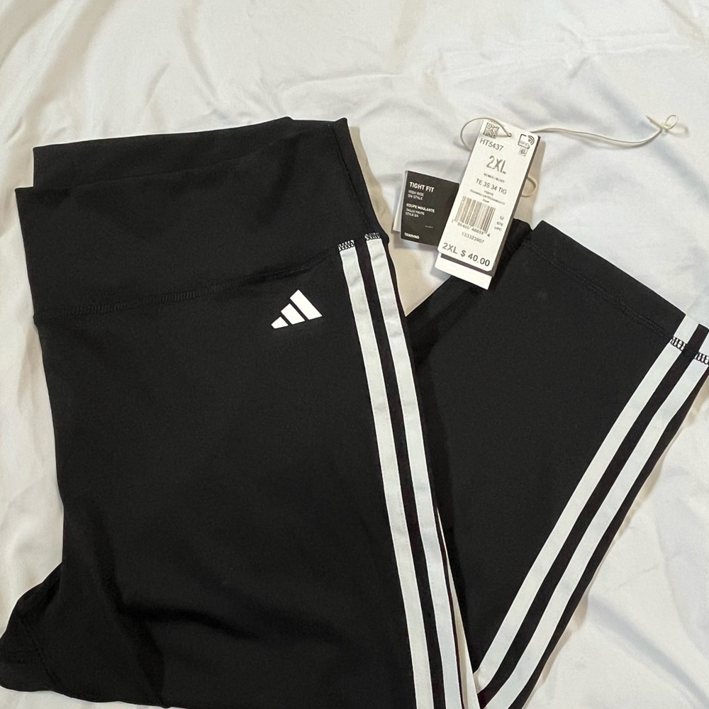 Adidas Black and White Track Pants with Iconic Stripes